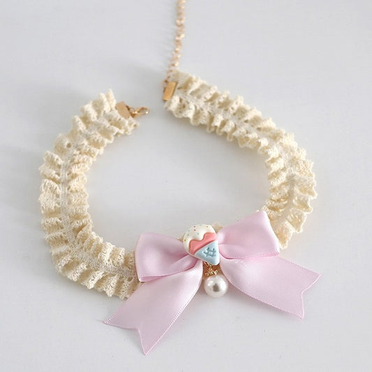 ビーズで飾られた蝶結びのベージュピンクのスイートチョーカーロリータチャームケーキ