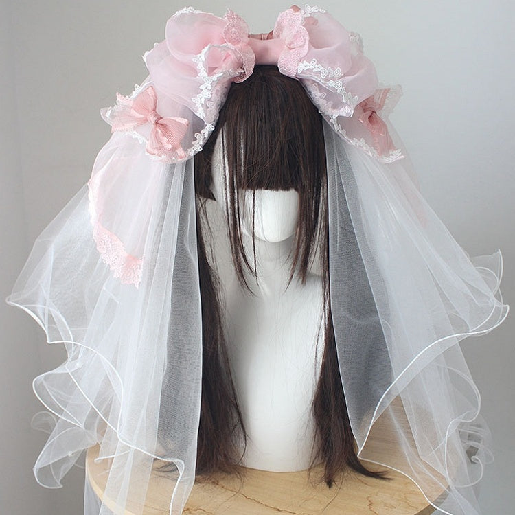 Nœud papillon rose avec bordure en dentelle et voile