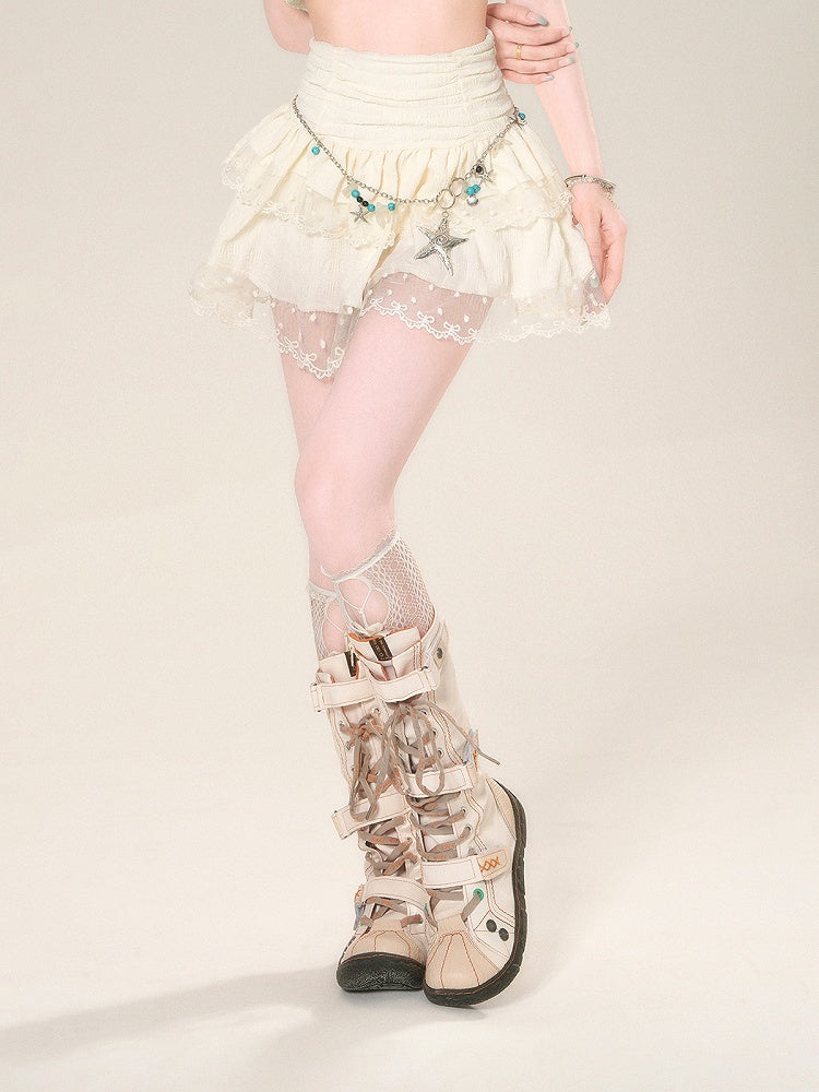 Taillenhoher Aprikosenrock mit Netzspitze und glamourösem Stufenmini