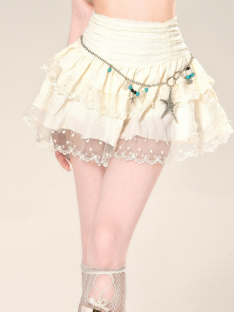 Taillenhoher Aprikosenrock mit Netzspitze und glamourösem Stufenmini