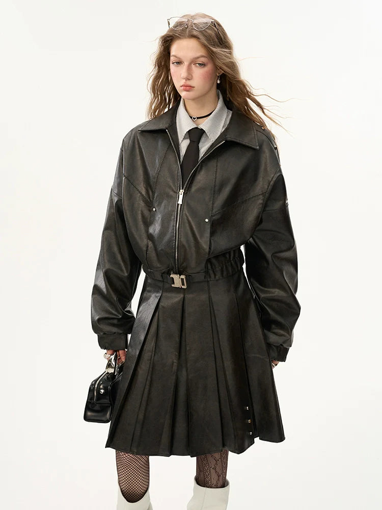 Veste en cuir mode endommagée + jupe moyenne + manteau en cuir avec ceinture
