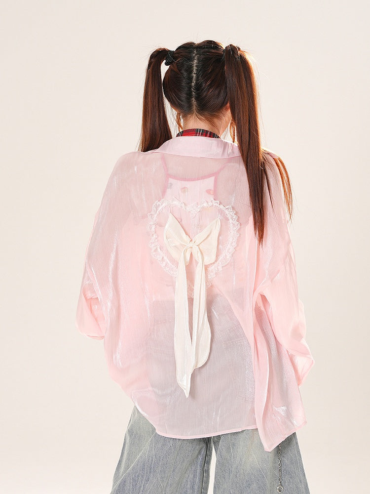Sonnenschutz-Shirt mit Herzmotiv in Rosa/Aprikose und Rüschenschleife auf der Rückseite