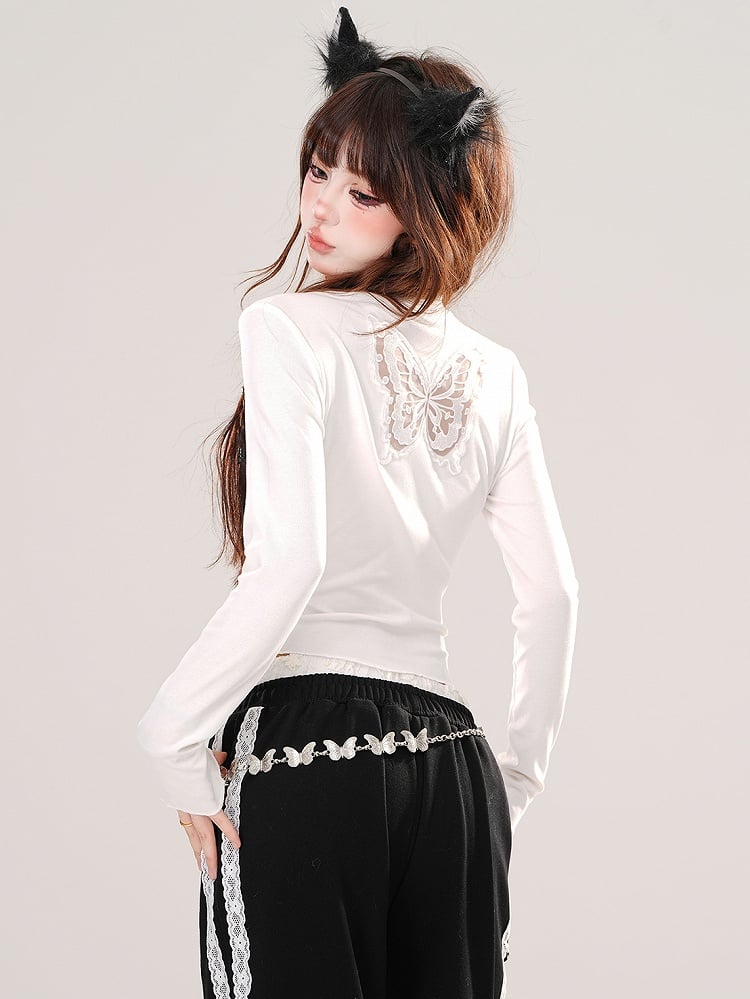 Haut court graphique en dentelle noire et blanche avec papillon dans le dos