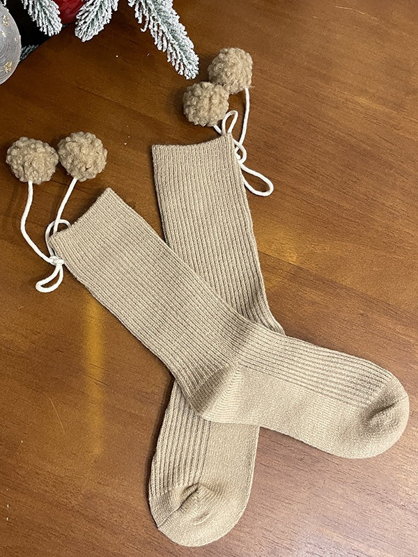 Chaussettes mollet blanches à pompons