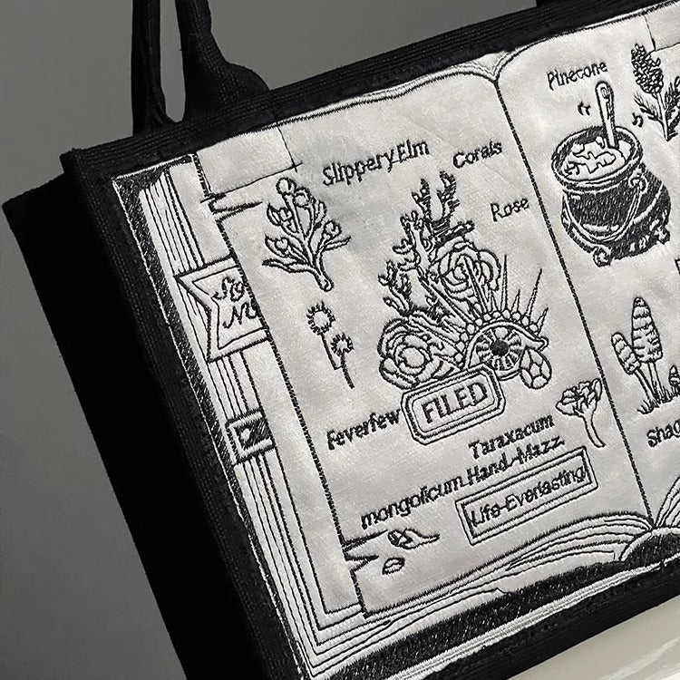 Sac à main brodé avec livre de magie noire