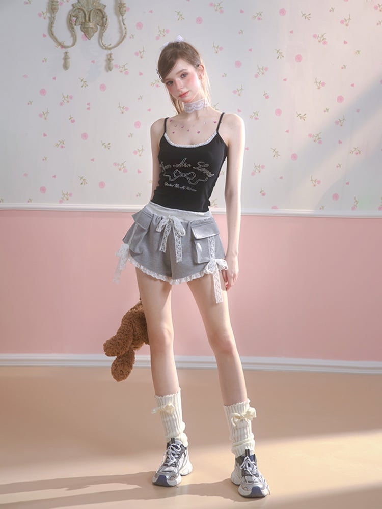 Schwarzes Camisole-Top mit Schleifenmuster und Spitzenbesatz