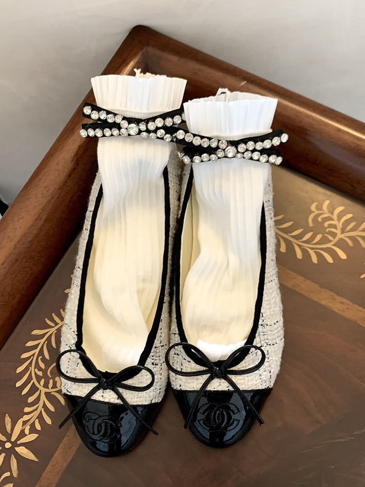 Schwarz/Milchweiße Wadensocken mit Strass-Schleife