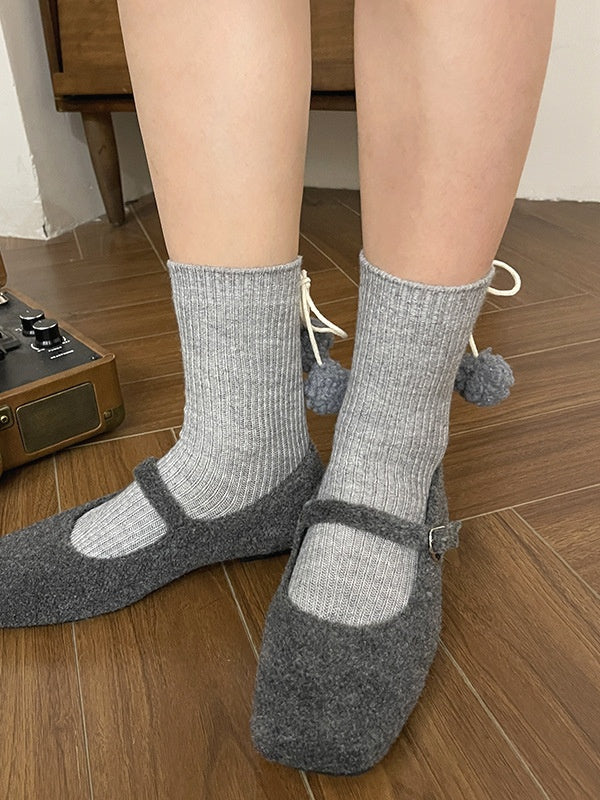 Chaussettes mollet blanches à pompons