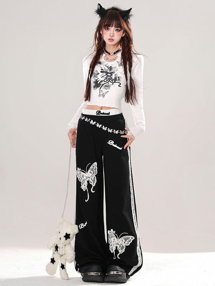 Haut court graphique en dentelle noire et blanche avec papillon dans le dos