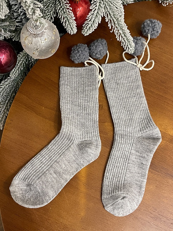 Chaussettes mollet blanches à pompons