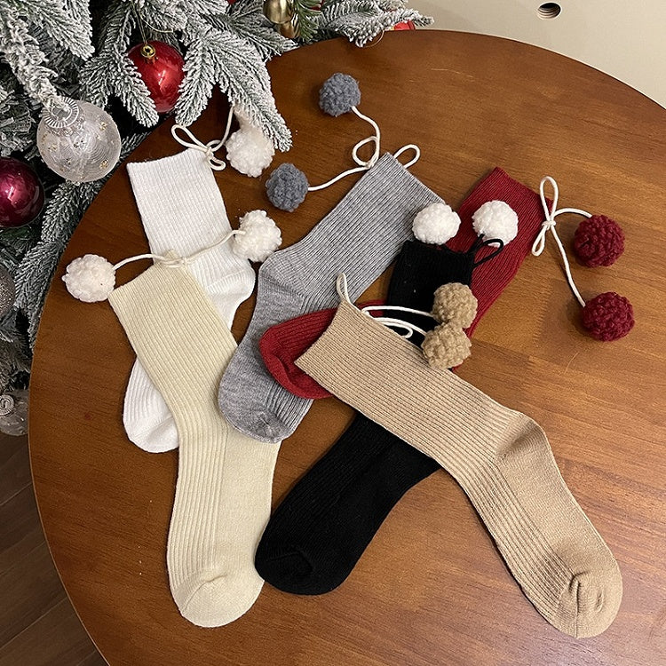 Chaussettes mollet blanches à pompons