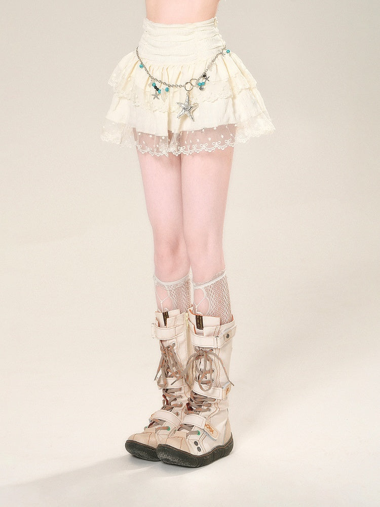 Taillenhoher Aprikosenrock mit Netzspitze und glamourösem Stufenmini