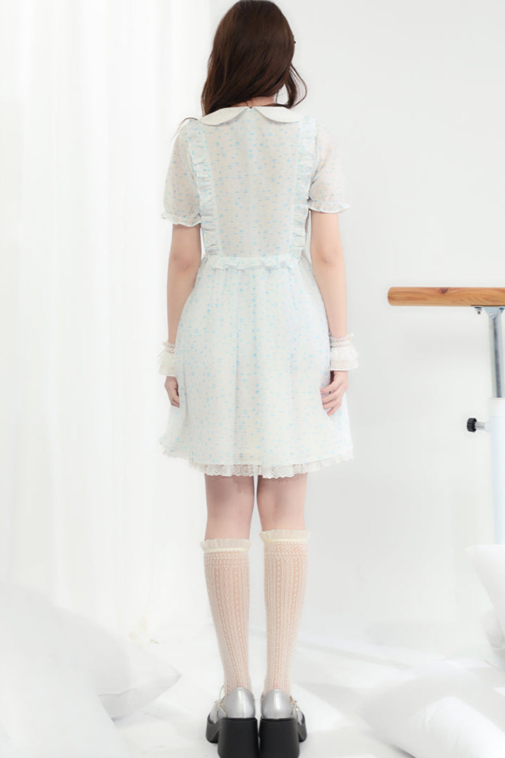 Puppe Ecosta Blumenkleid transparent