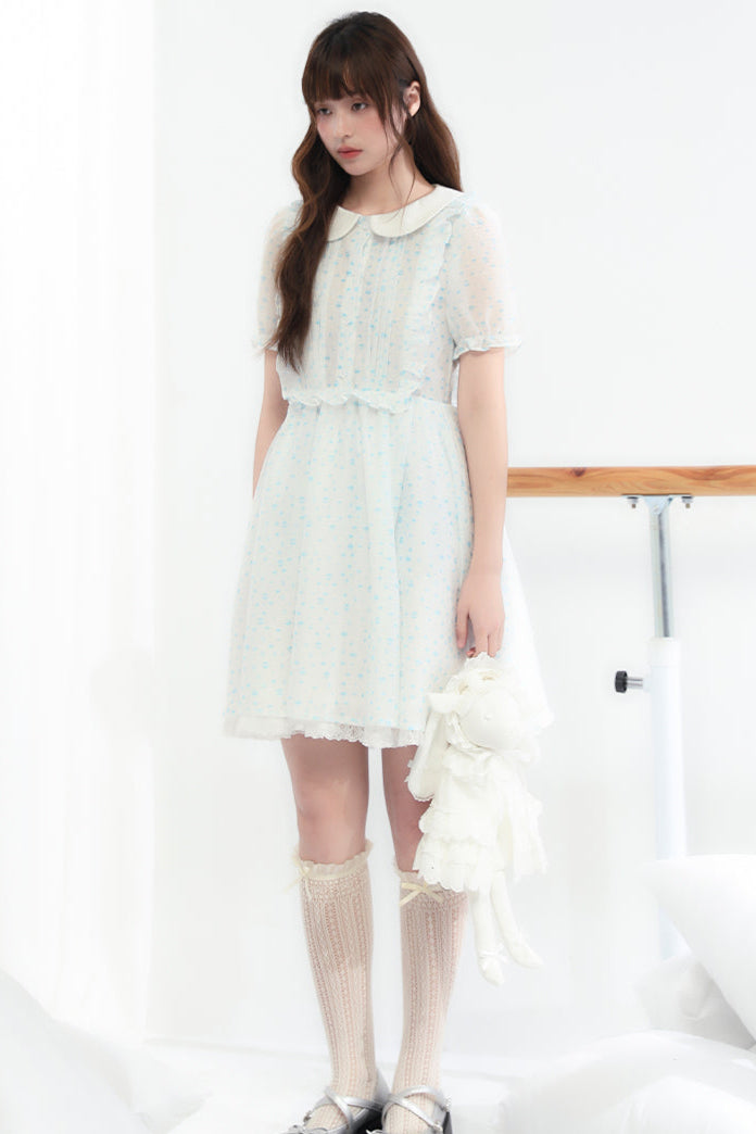 Puppe Ecosta Blumenkleid transparent