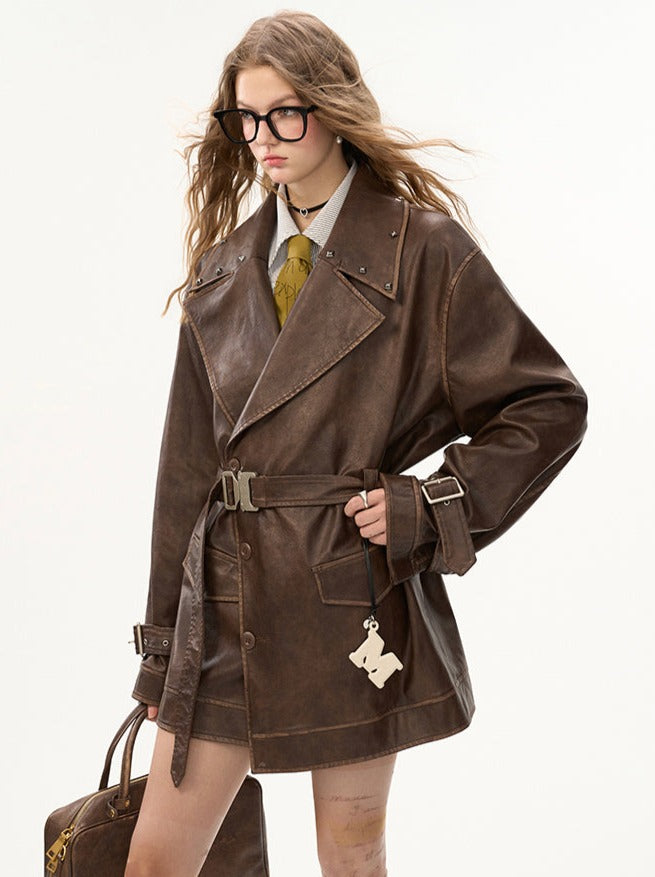 Veste en cuir mode endommagée + jupe moyenne + manteau en cuir avec ceinture