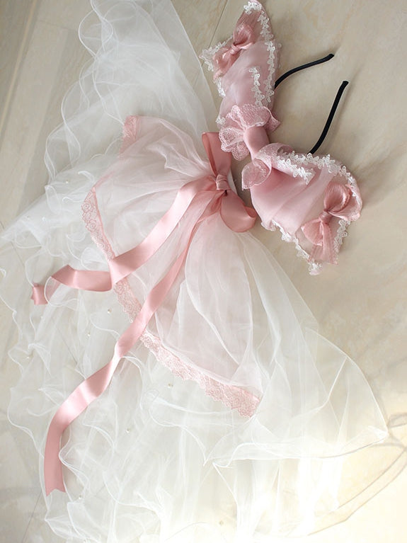 Nœud papillon rose avec bordure en dentelle et voile