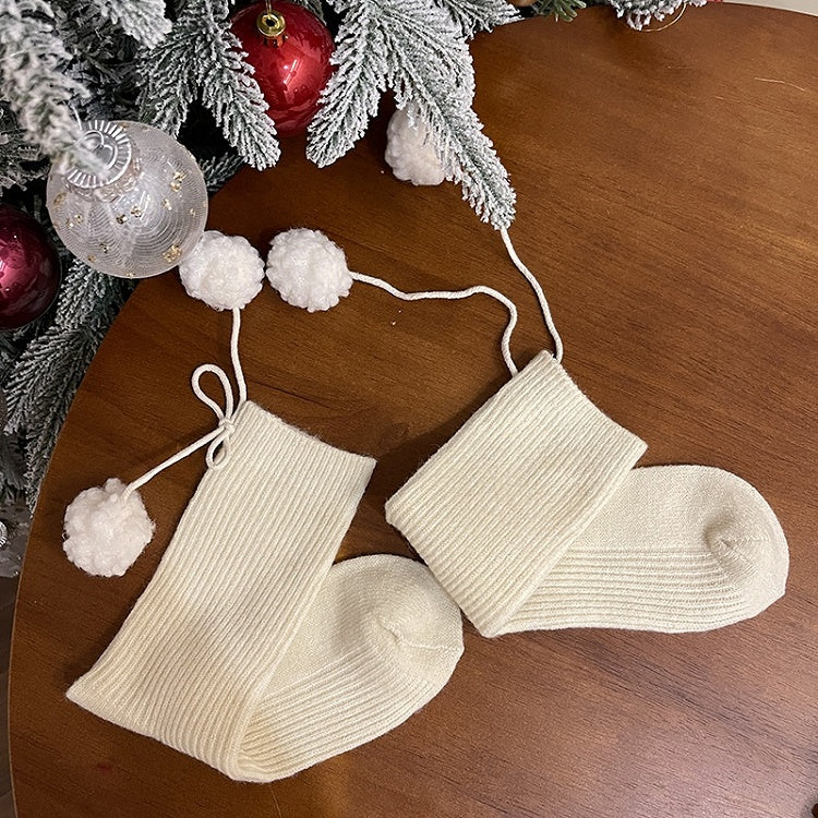 Chaussettes mollet blanches à pompons