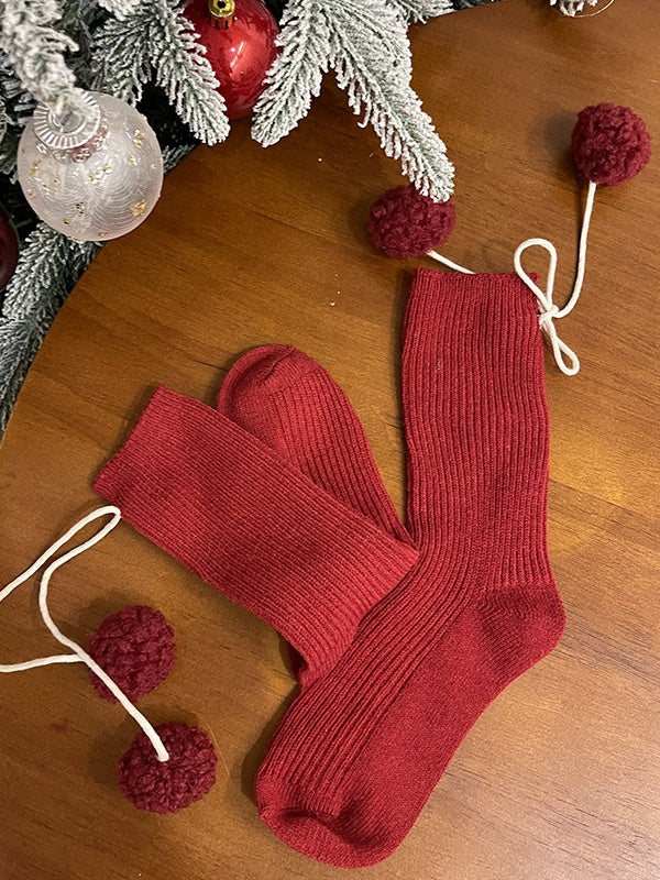 Chaussettes mollet blanches à pompons