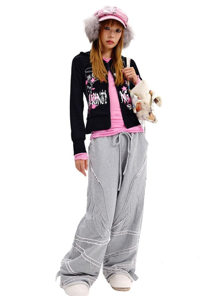 Kissenförmige Umhängetasche in Beige/Schwarz mit Sternriemen