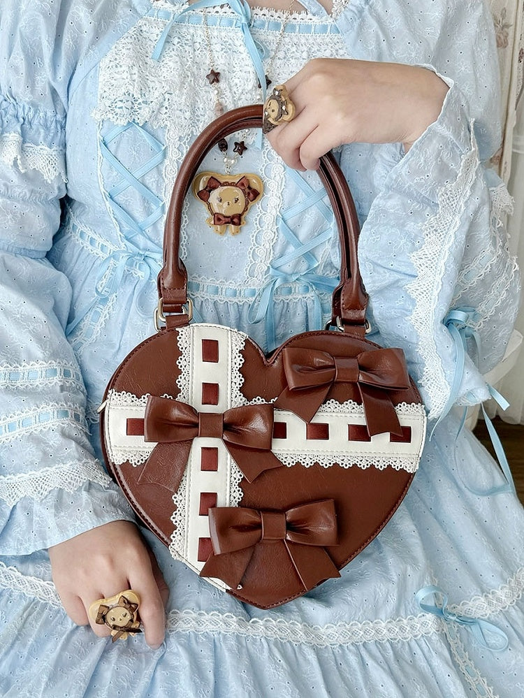 PU-Tasche mit süßen Details, Herz-Schleife, braunes Leder an den Riemen, gewellter Saum