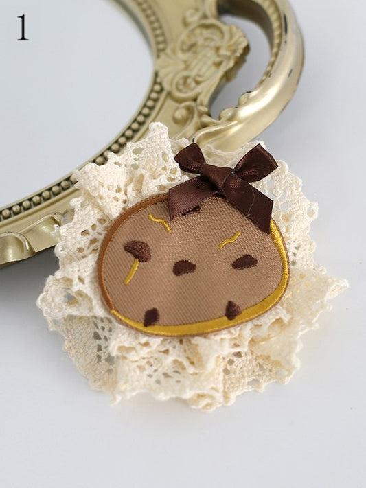 クッキーの蝶結びで飾られたヘアクリップ 6つのオプション