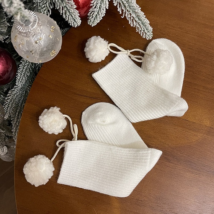 Chaussettes mollet blanches à pompons