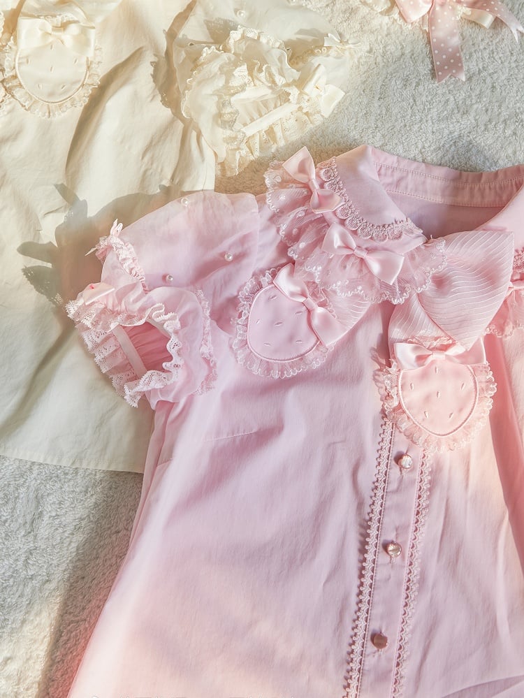 Rosa Bluse mit abnehmbarer Schleife am Ausschnitt und Perlen und kurzen Puffärmeln
