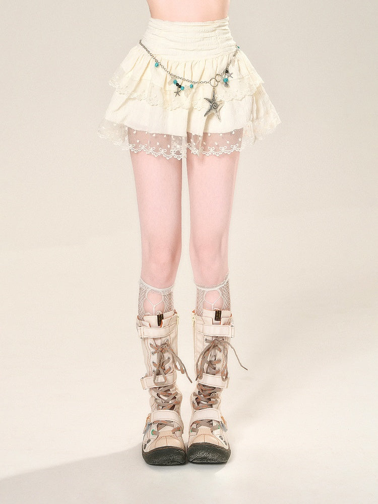 Taillenhoher Aprikosenrock mit Netzspitze und glamourösem Stufenmini