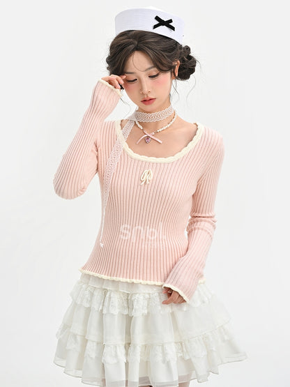 Haut en maille slim à col rond et détails nœud rose