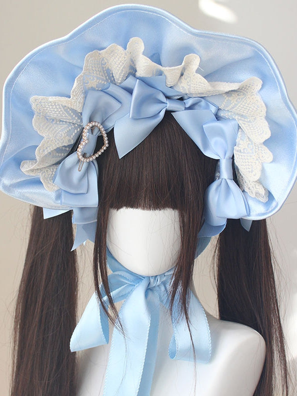 Bonnet à bordure en dentelle et nœud décoratif orné de perles