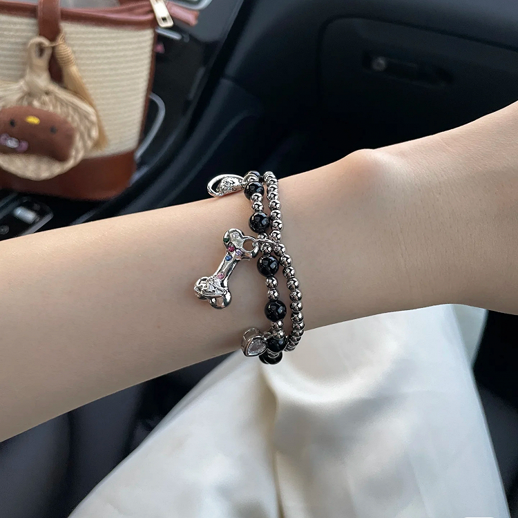 Bracelet à breloques en os de Saturne blanc/noir/rouge
