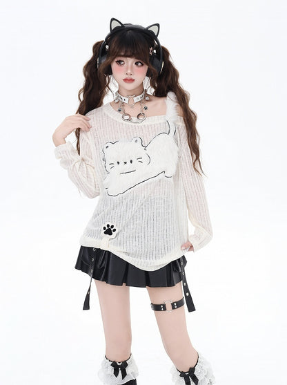 Haut semi-transparent beige à encolure asymétrique et appliqué chat