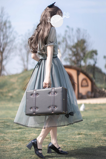 brooch dress Nostalgic ribbon top + traveling Alice outer