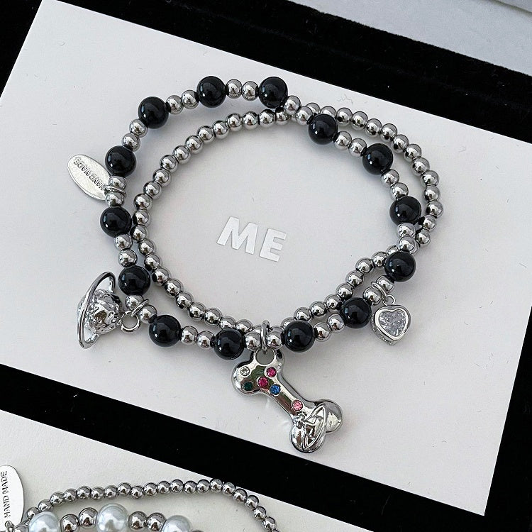 Bracelet à breloques en os de Saturne blanc/noir/rouge