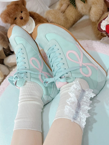 Grüne Schnürschuhe mit Schleife vorne