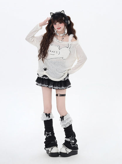 Haut semi-transparent beige à encolure asymétrique et appliqué chat