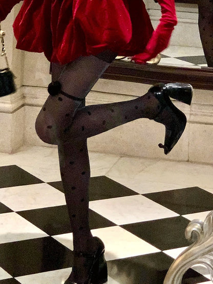 Collants noirs scintillants à pois et accents de roses
