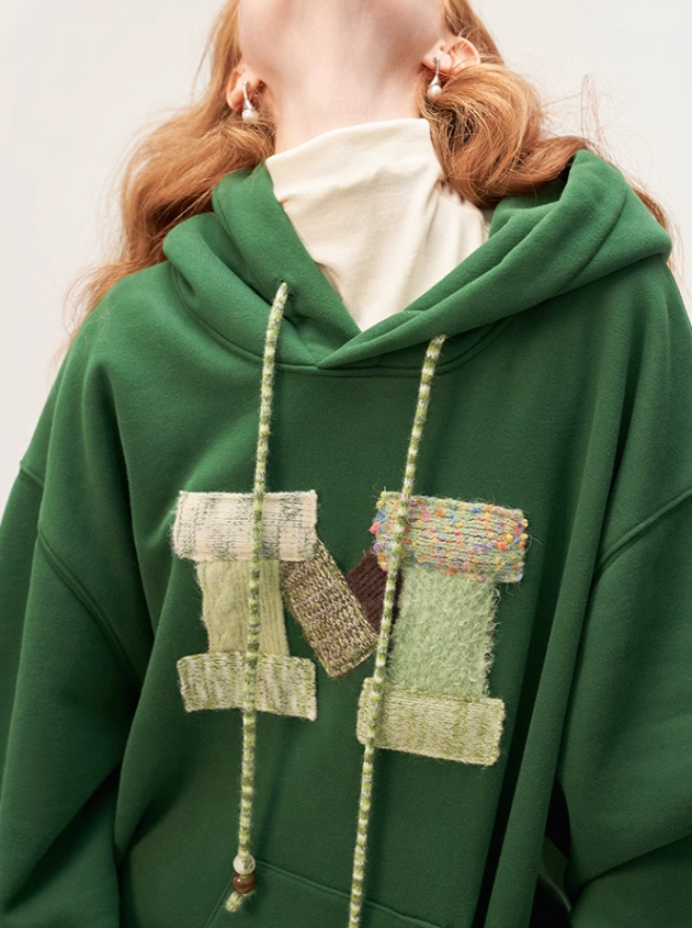 Sweat à capuche ample avec logo en laine