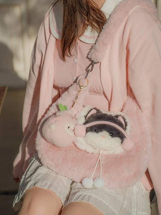 Sac bandoulière en peluche rose avec pompons