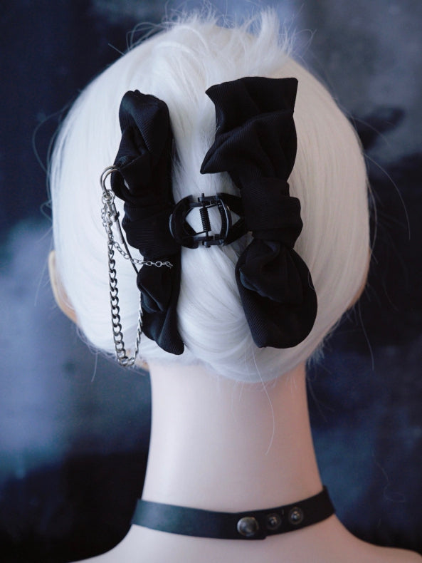 Schwarzer Bowknot-Clip verzierte Klaue mit Kreuz