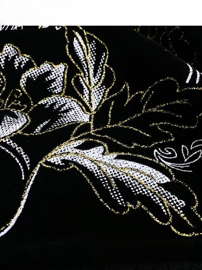 Robe Qipao en velours noir avec broderie florale et détails découpés, bouton et nœud
