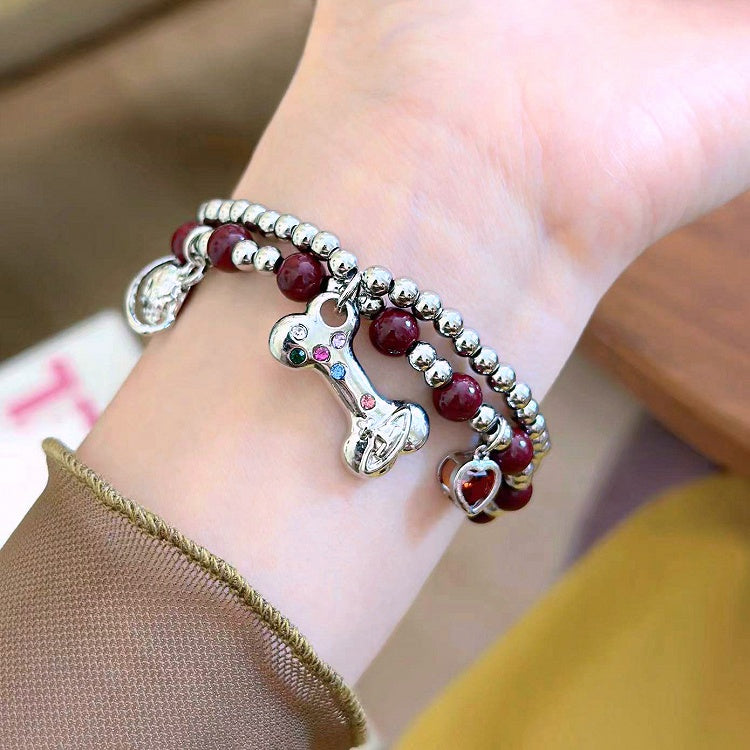Bracelet à breloques en os de Saturne blanc/noir/rouge