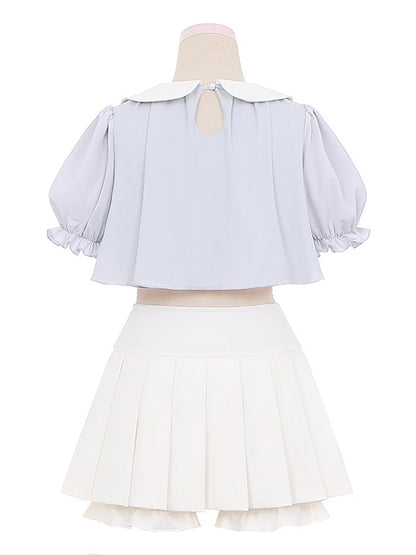 Ensemble haut col Claudine brodé bleu et jupe plissée blanche