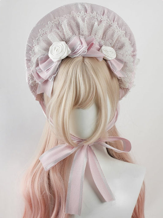 Bonnet Lolita rose à gros nœud et bordure en dentelle florale à volants