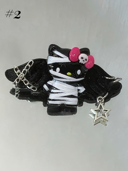 Pinces à cheveux Guro Kawaii Mummy Kitty noires/blanches