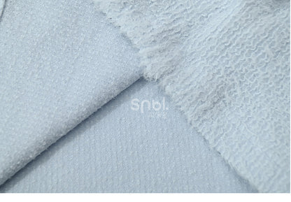 Haut à manches longues et col en peluche bleu avec détails nœud
