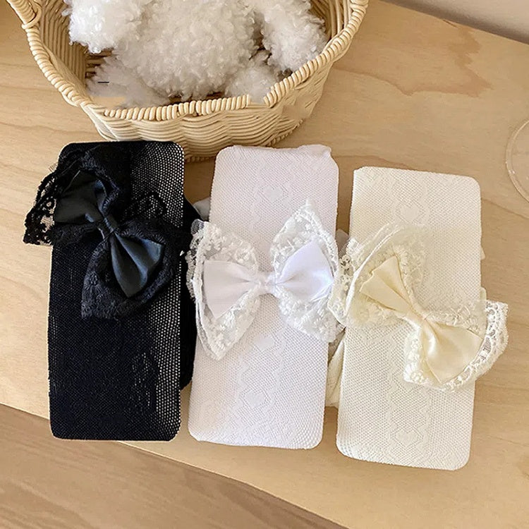 Collants résille noirs/blancs avec nœud blanc crème décoré de nœud et de cœur