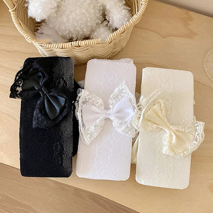 Collants résille noirs/blancs avec nœud blanc crème décoré de nœud et de cœur