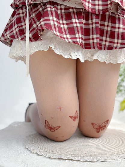 Nackte Lolita-Strumpfhose mit Schmetterlings-Tattoo