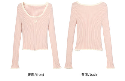 Haut en maille slim à col rond et détails nœud rose